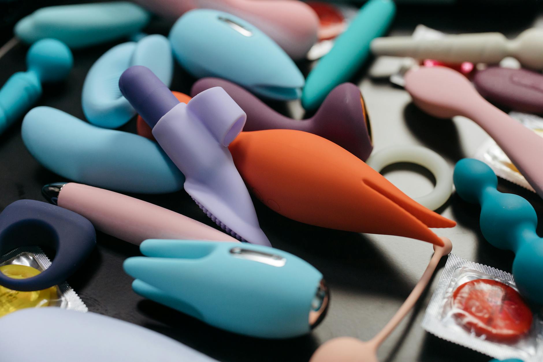 An array of vibrant lemon vibrators and other adult toys in a close-up view